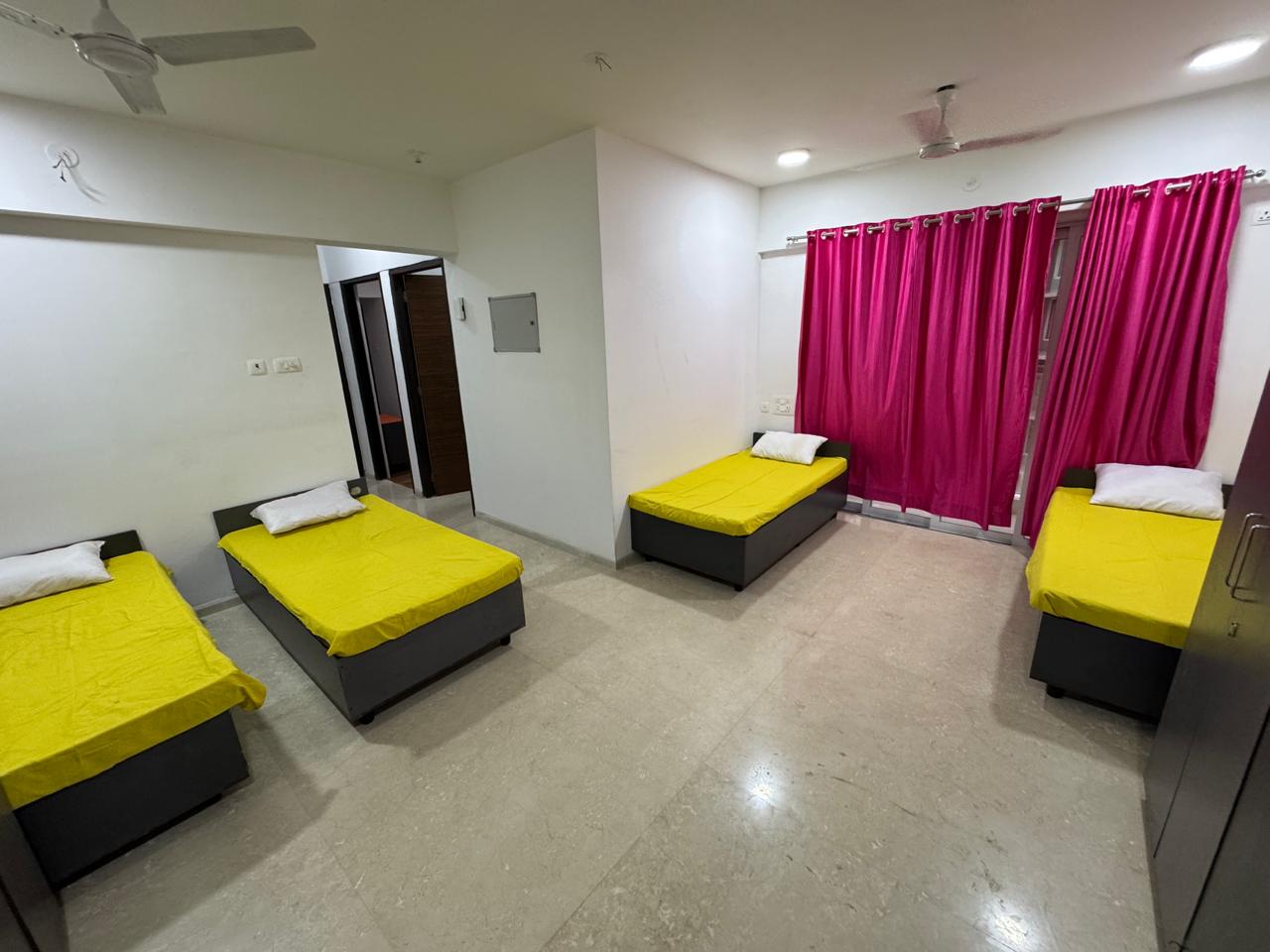 Four-sharing hall in PG in Goregaon West, Mumbai
