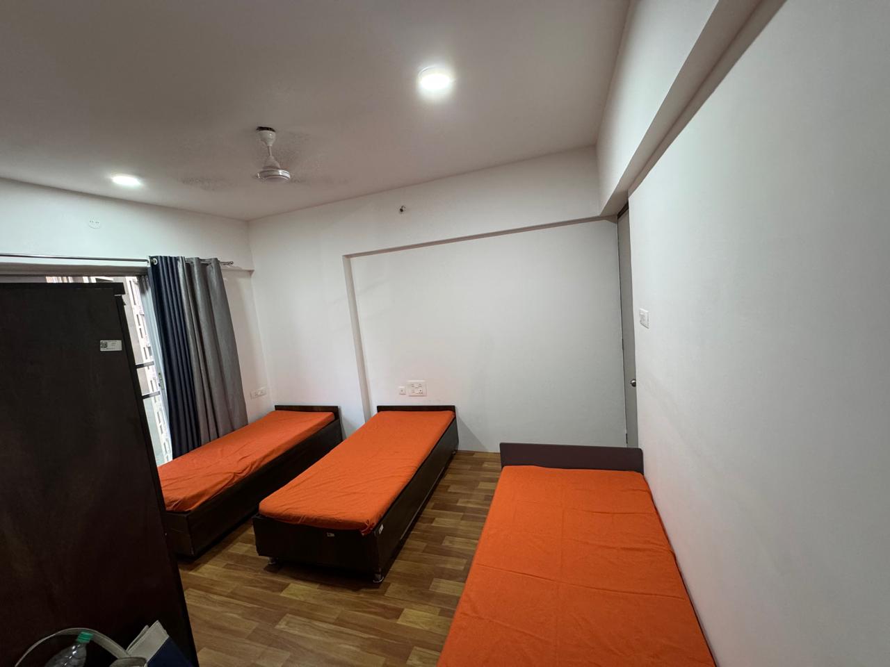 Three-sharing bedroom in PG in Goregaon West, Mumbai